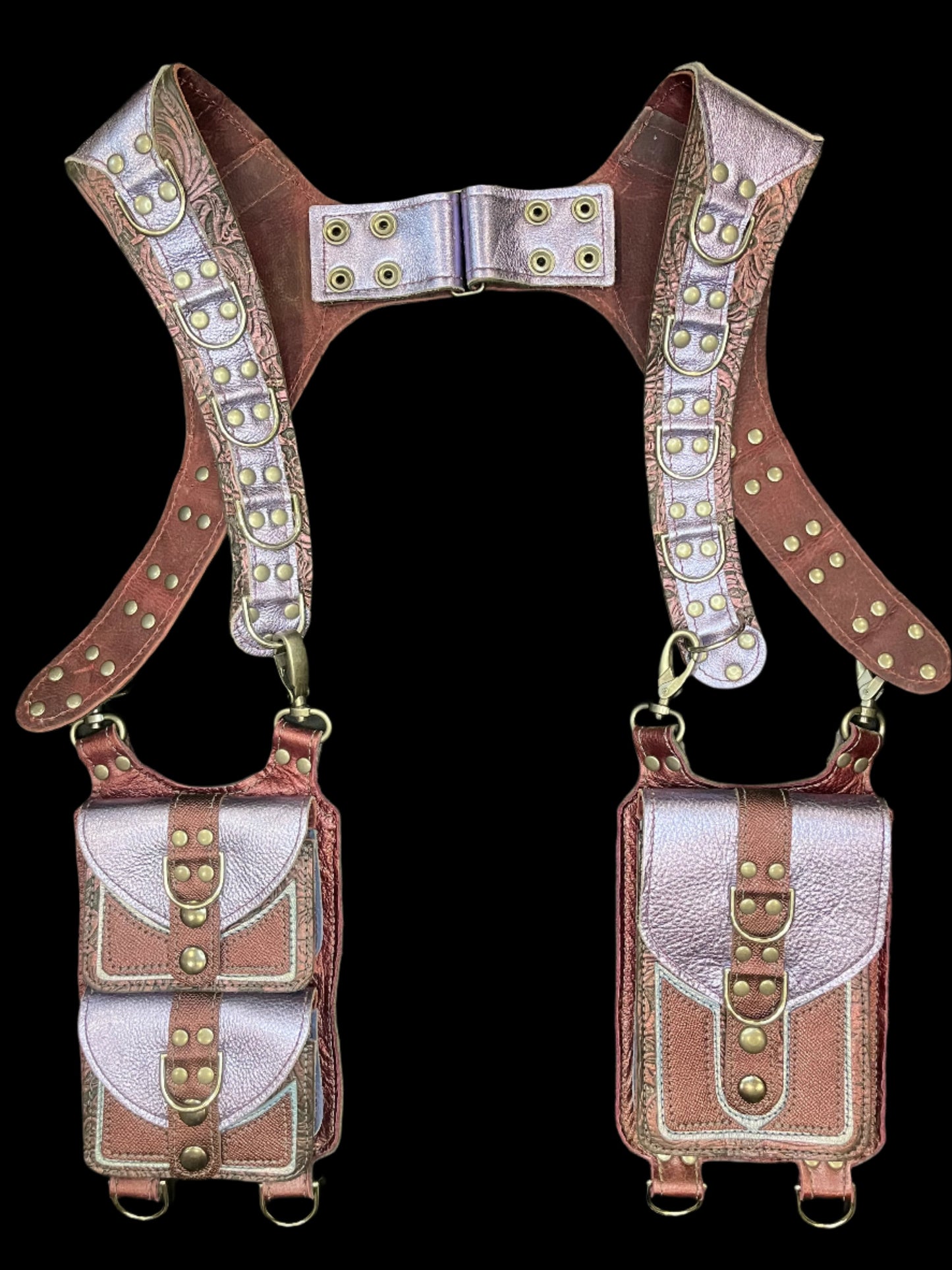 Belladonna holster in maroon and Lilac leather laid flat on a black background