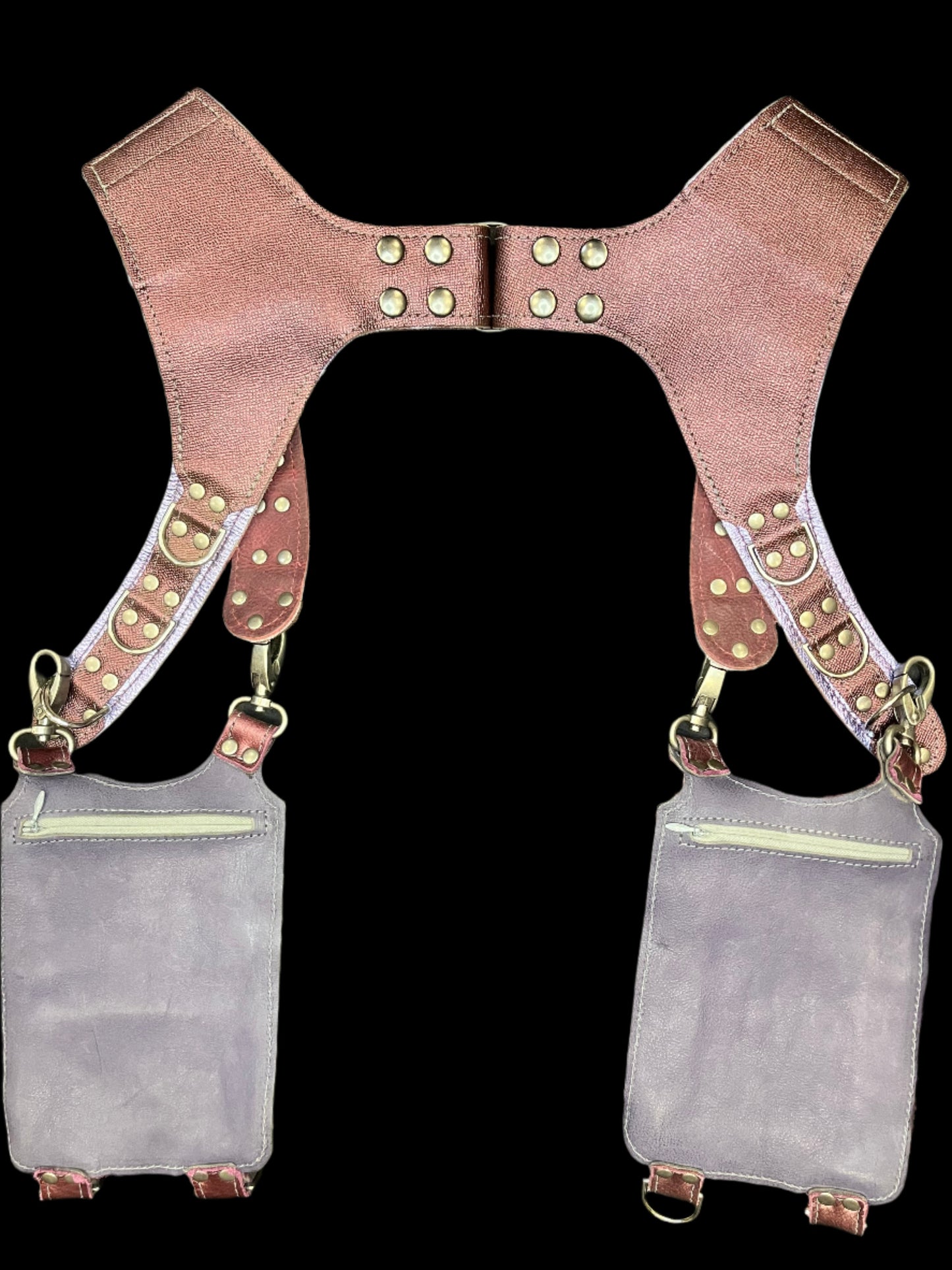 Back view of belladonna holster showing dusty purple leather backing and hidden zipper pockets on the back of the hanging pockets