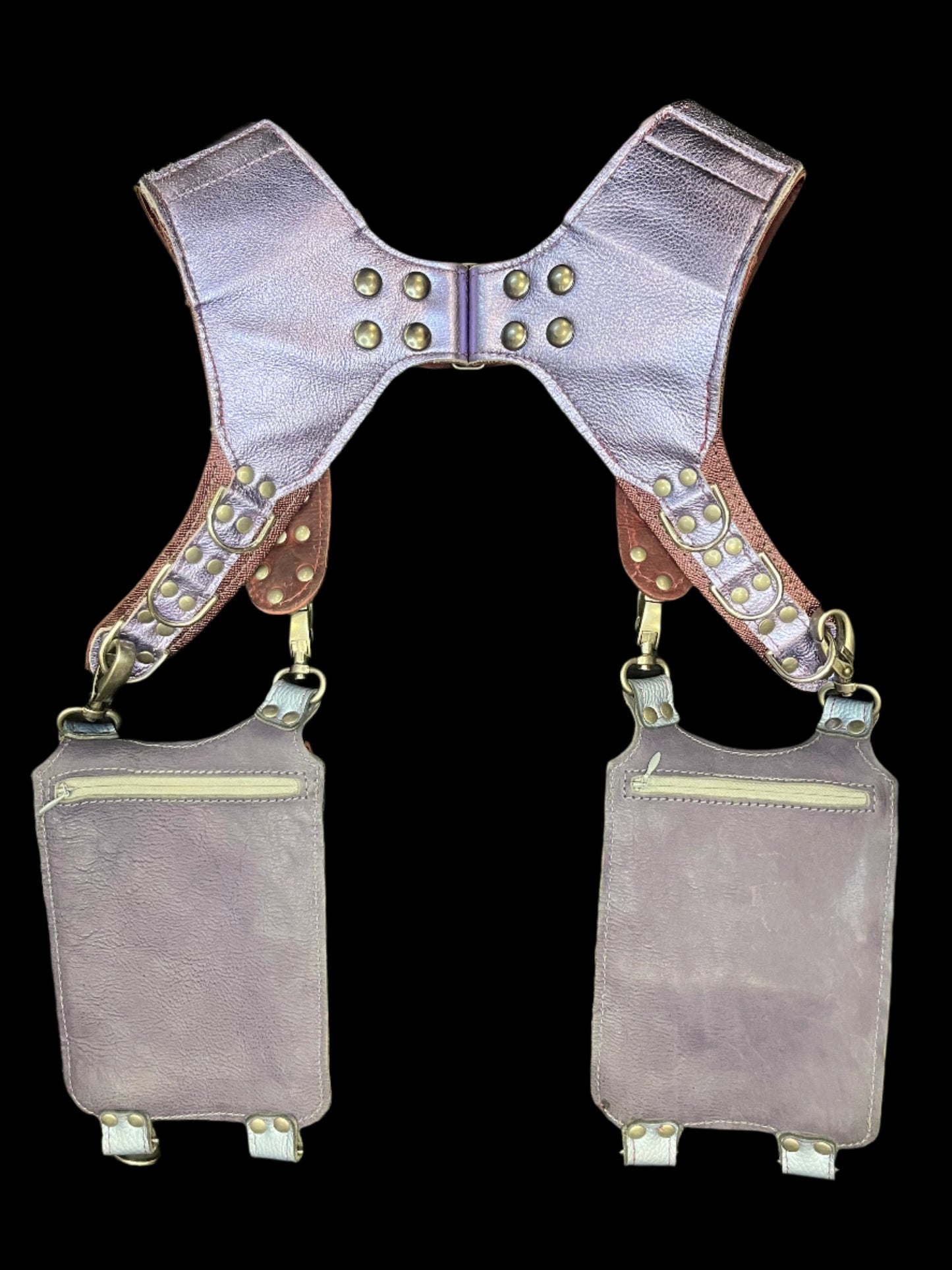 Back view of belladonna holster showing dusty purple leather backing and hidden zipper pockets