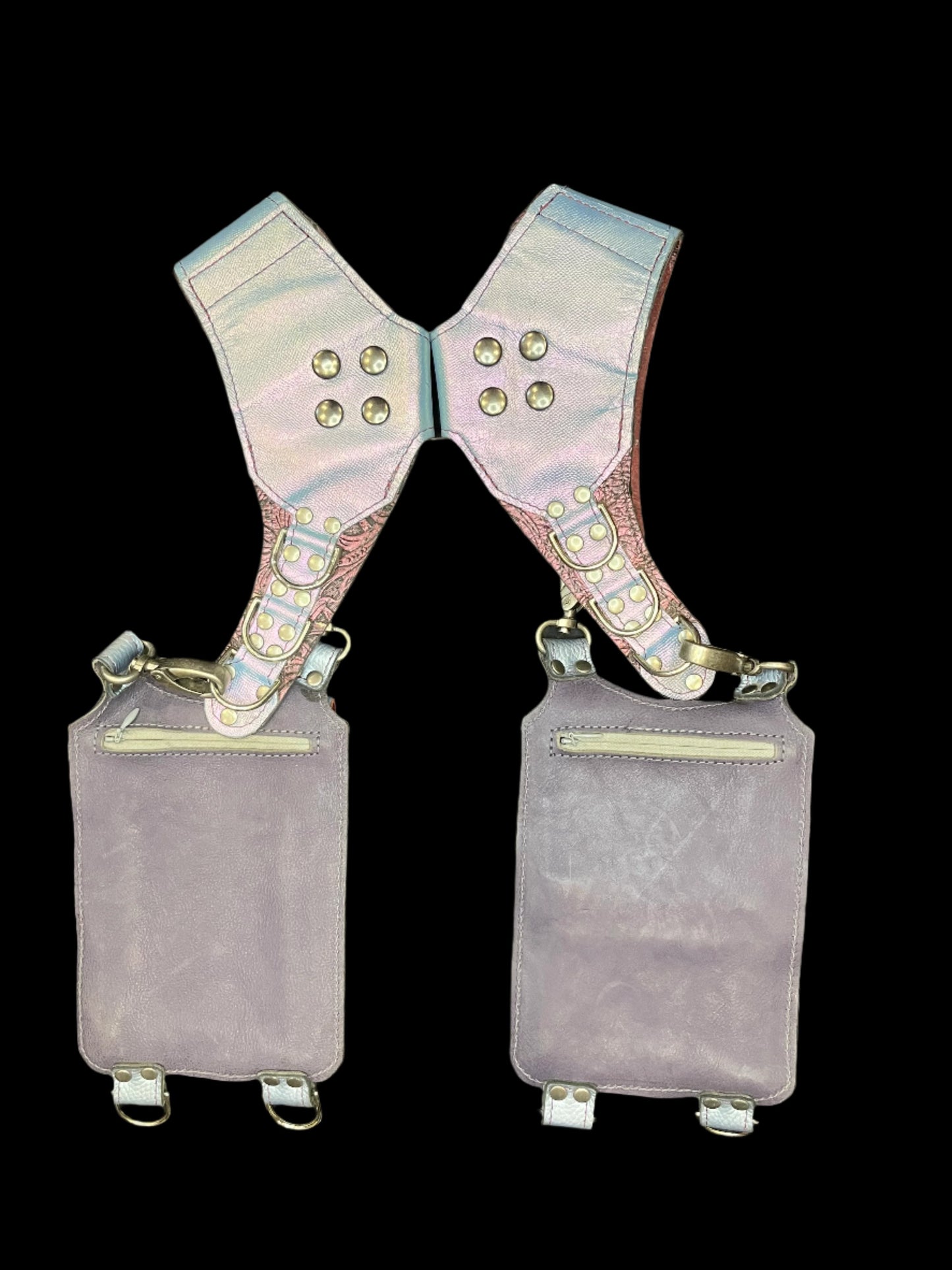 Back view of belladonna holster showing dusty purple backing leather and hidden zipper pockets