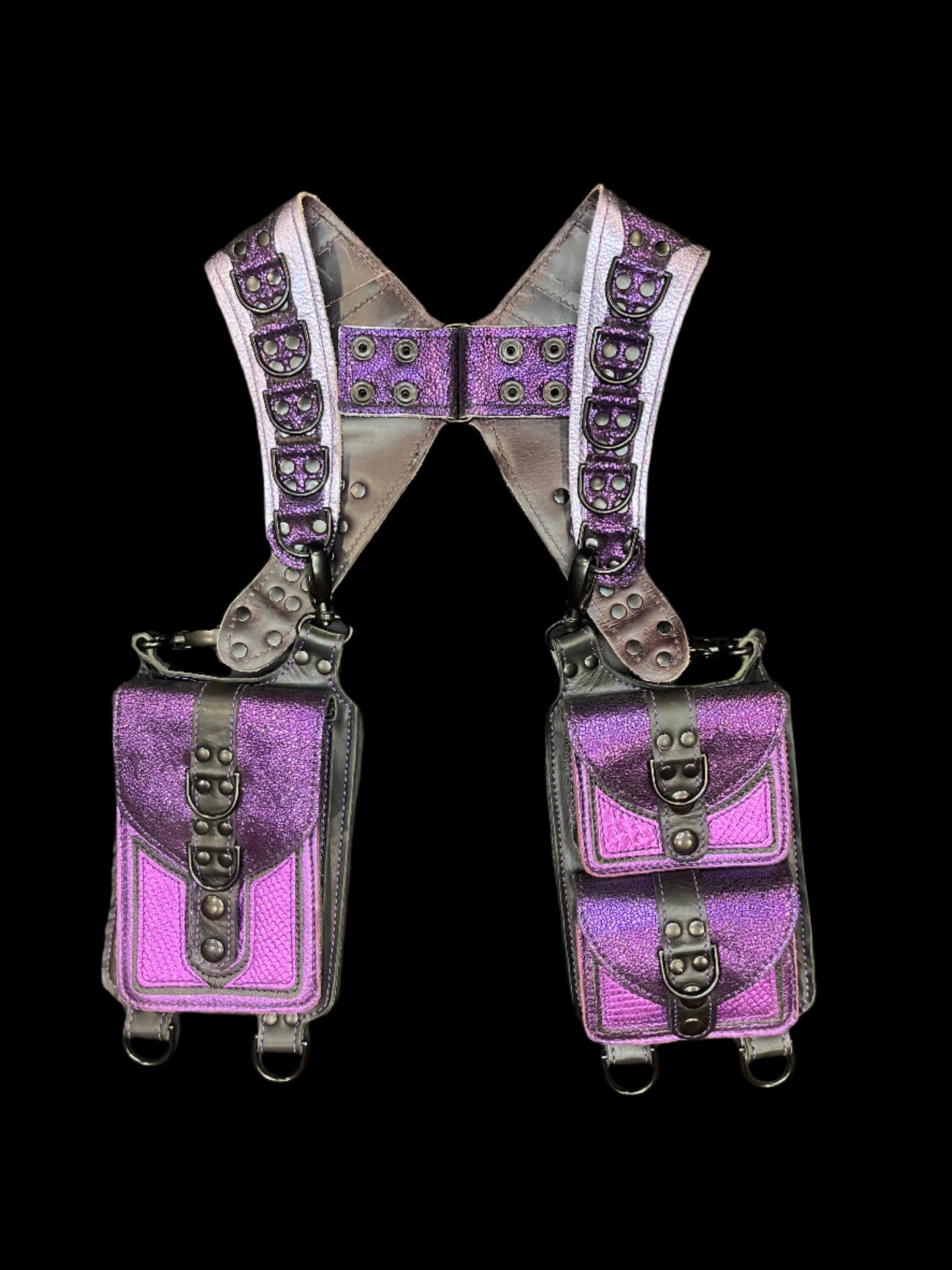 Purple and black leather holster laid flat on a black background