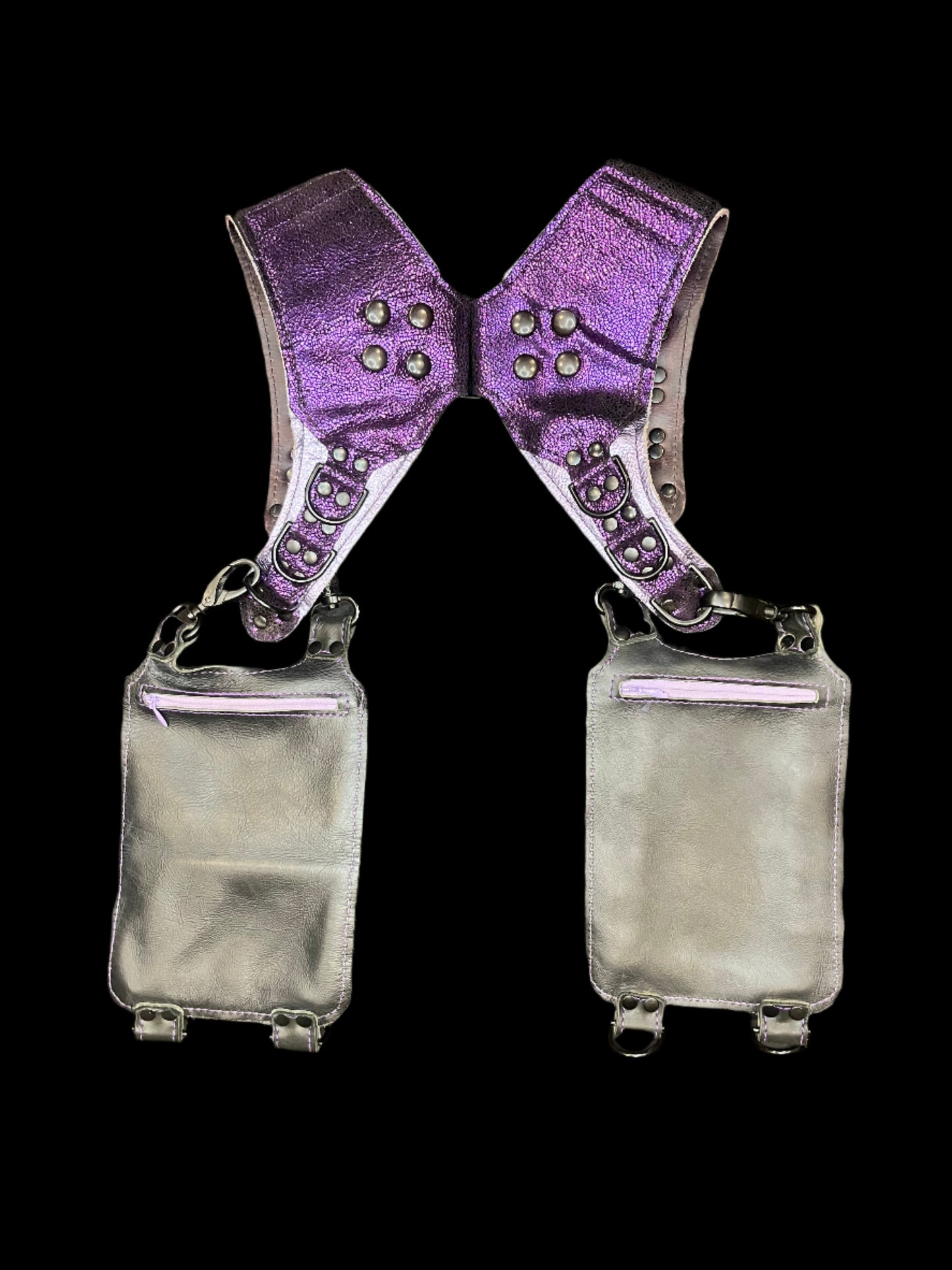 Back view of purple and black holster showing hidden zipper pockets on hanging pockets