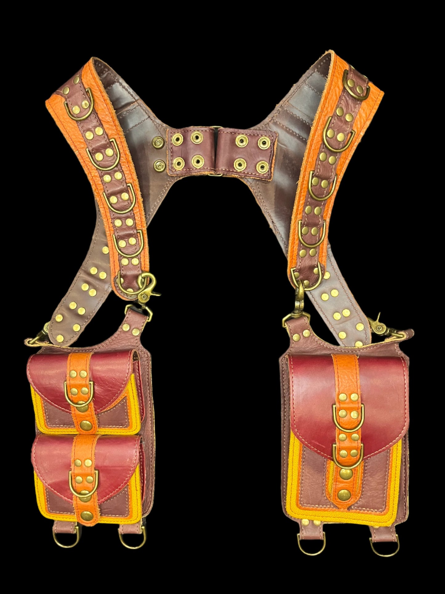 Orange and red leather holster laid flat on a black background