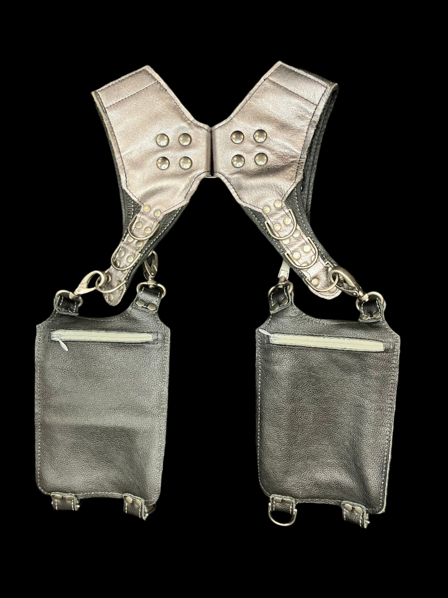 Back view of Izzy holster on a black background showing hidden zipper pockets