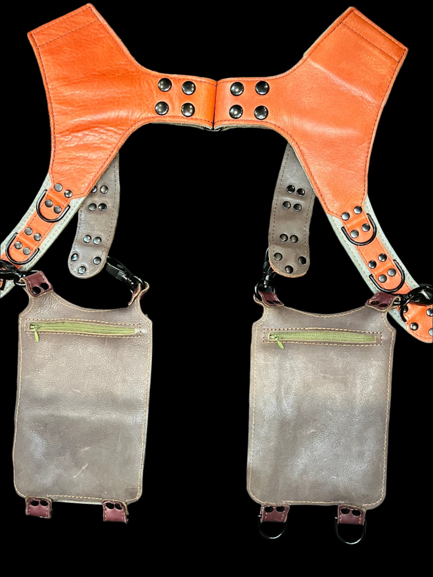 Back view of Carnelian Koi holster showing taupe leather backing and hidden zipper pockets on the back of the hanging pockets