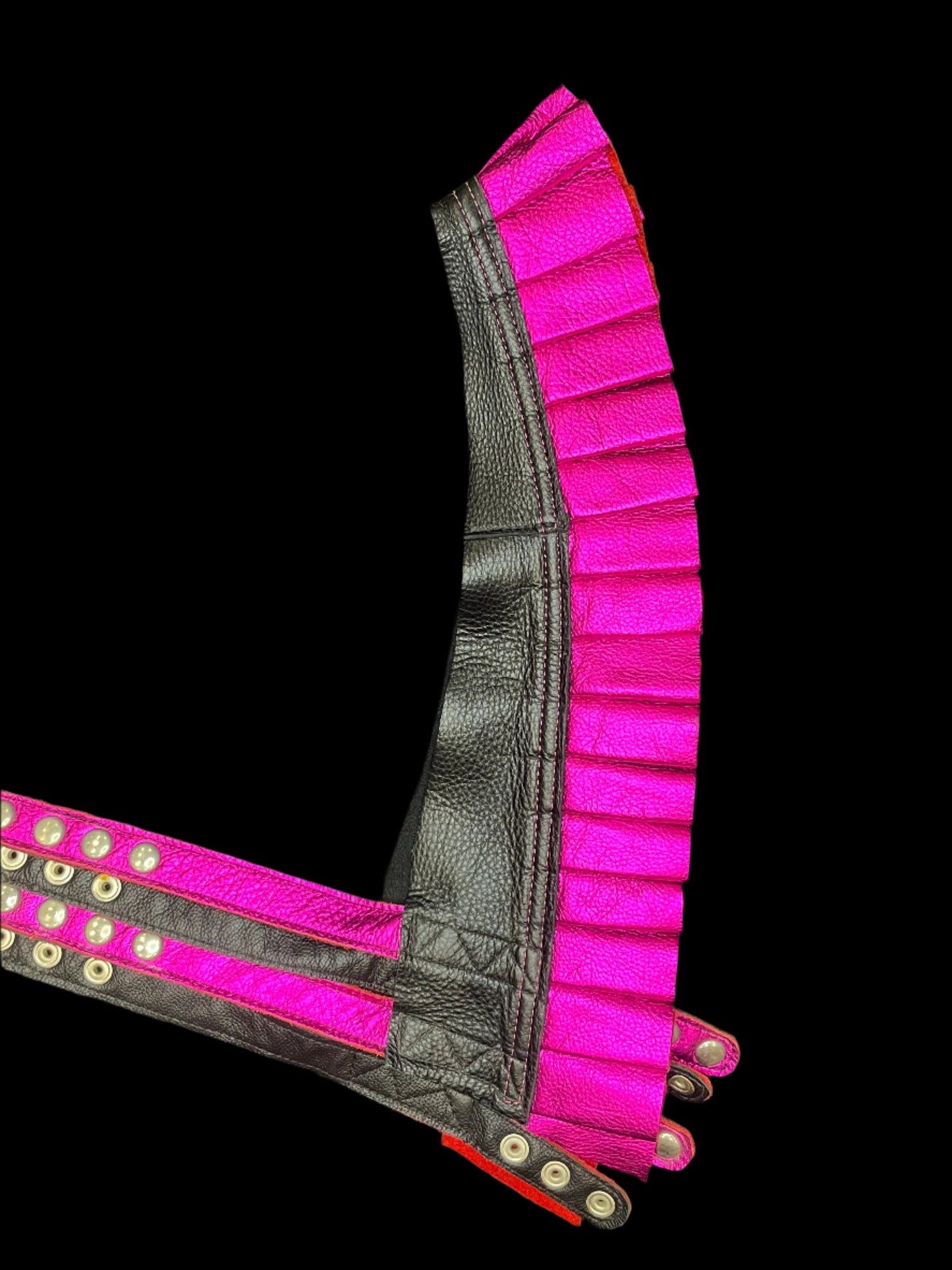 Black and metallic magenta leather ruff top laid flat on a black background