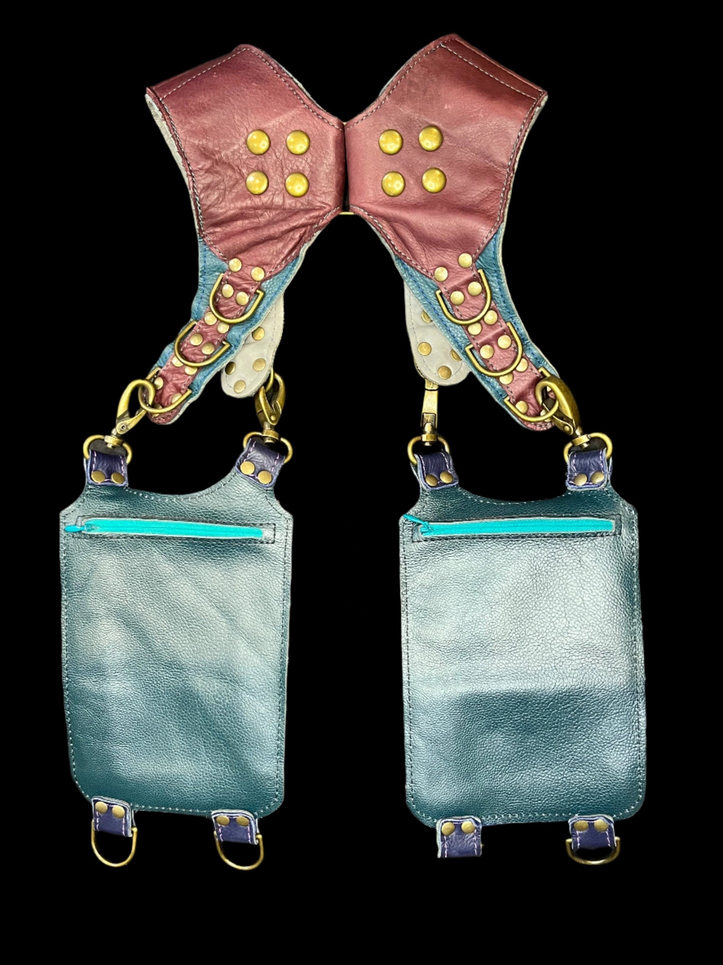 Back view of Wallflower holster showing teal leather backing and hidden zipper pockets on back of hanging pockets