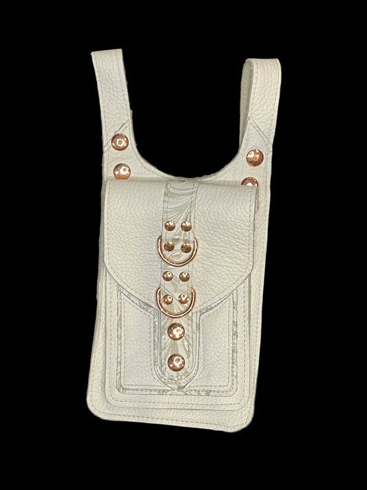 white leather thigh bag with rose gold hardware flat on a black background