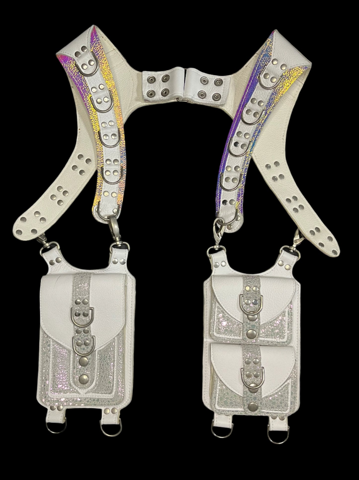 white and shiny prism leather holster with nickel hardware laid flat on a black background