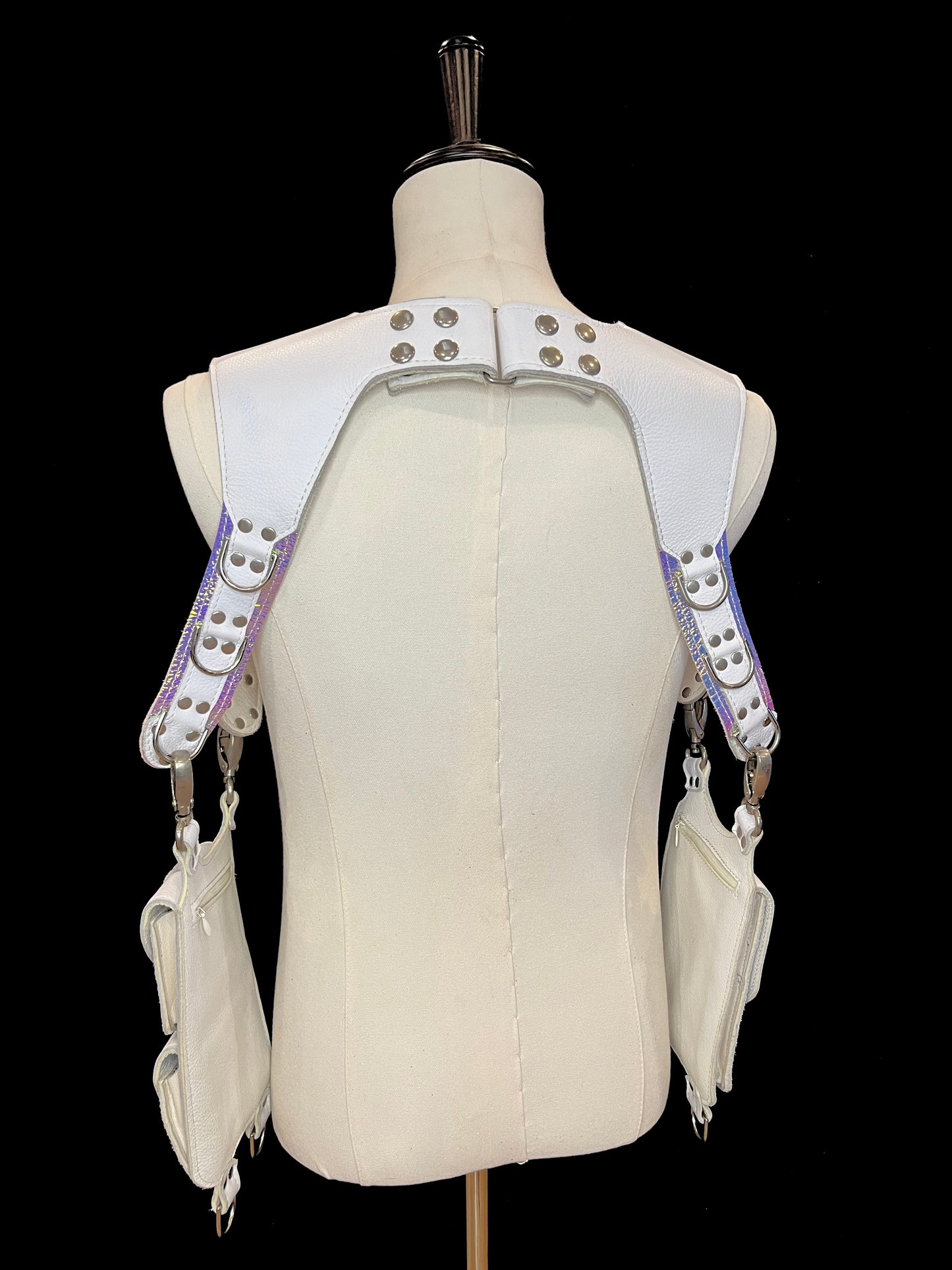 back view of falcor holster on an ivory gender neutral mannequin against a black background