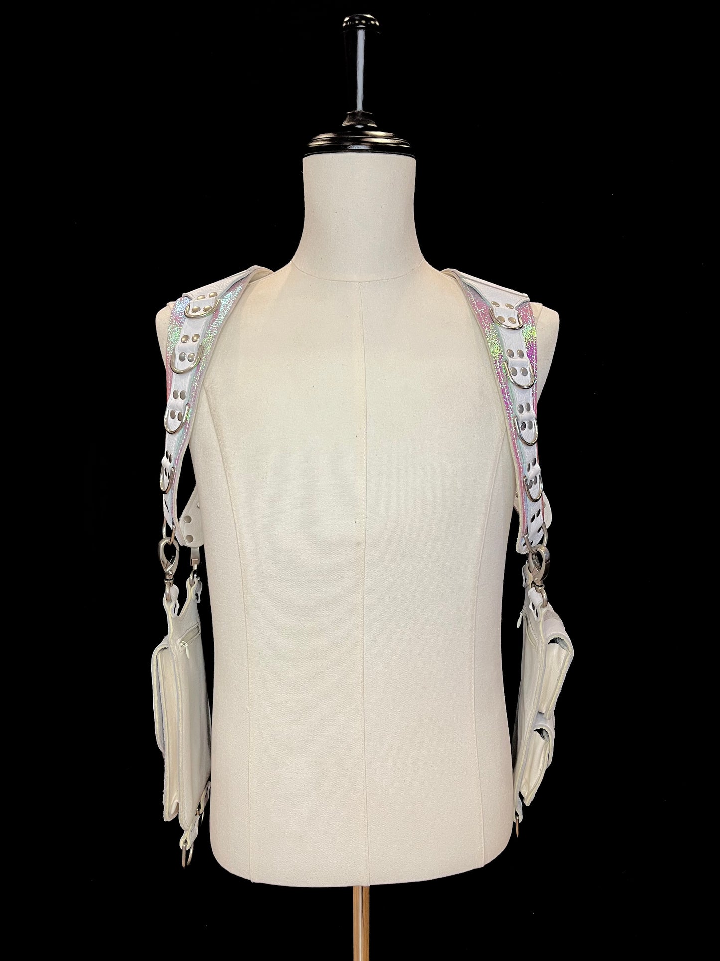Front view of Falcor holster on an ivory gender neutral mannequin and black background.