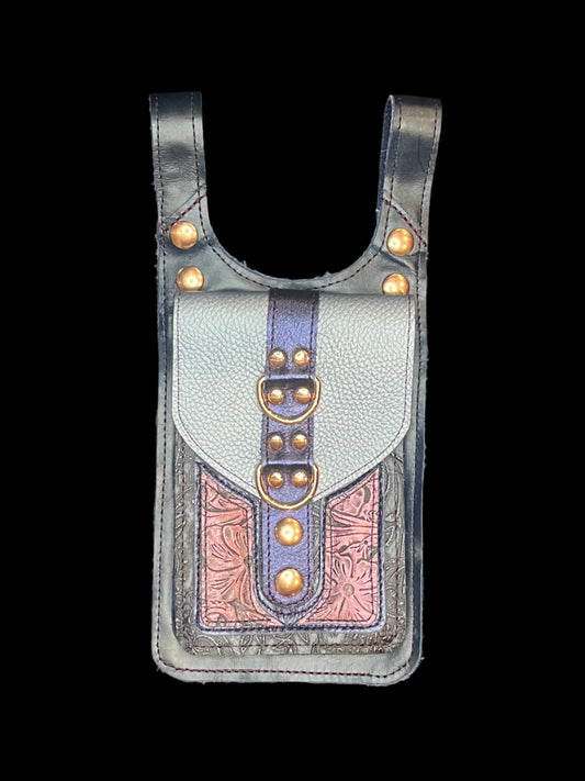 Cordelia thigh bag in blue and maroon leather with rose gold hardware on a black background