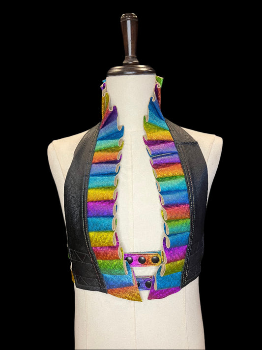 Ruff top with black leather neck and rainbow leather ruff and black hardware on ivory gender neutral mannequin against a black background