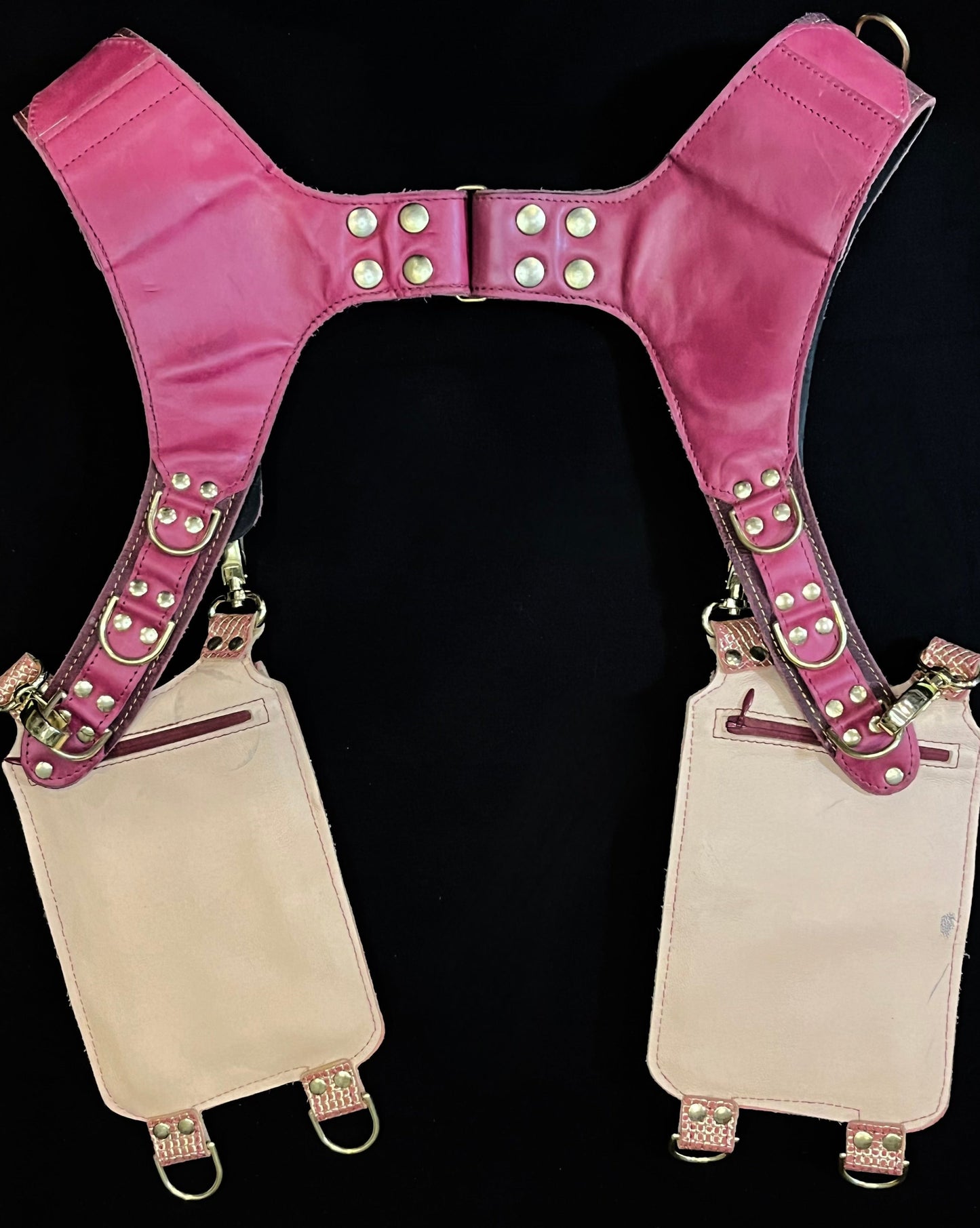 back view of pink and plum holster showing hidden zipper pockets on hanging pockets