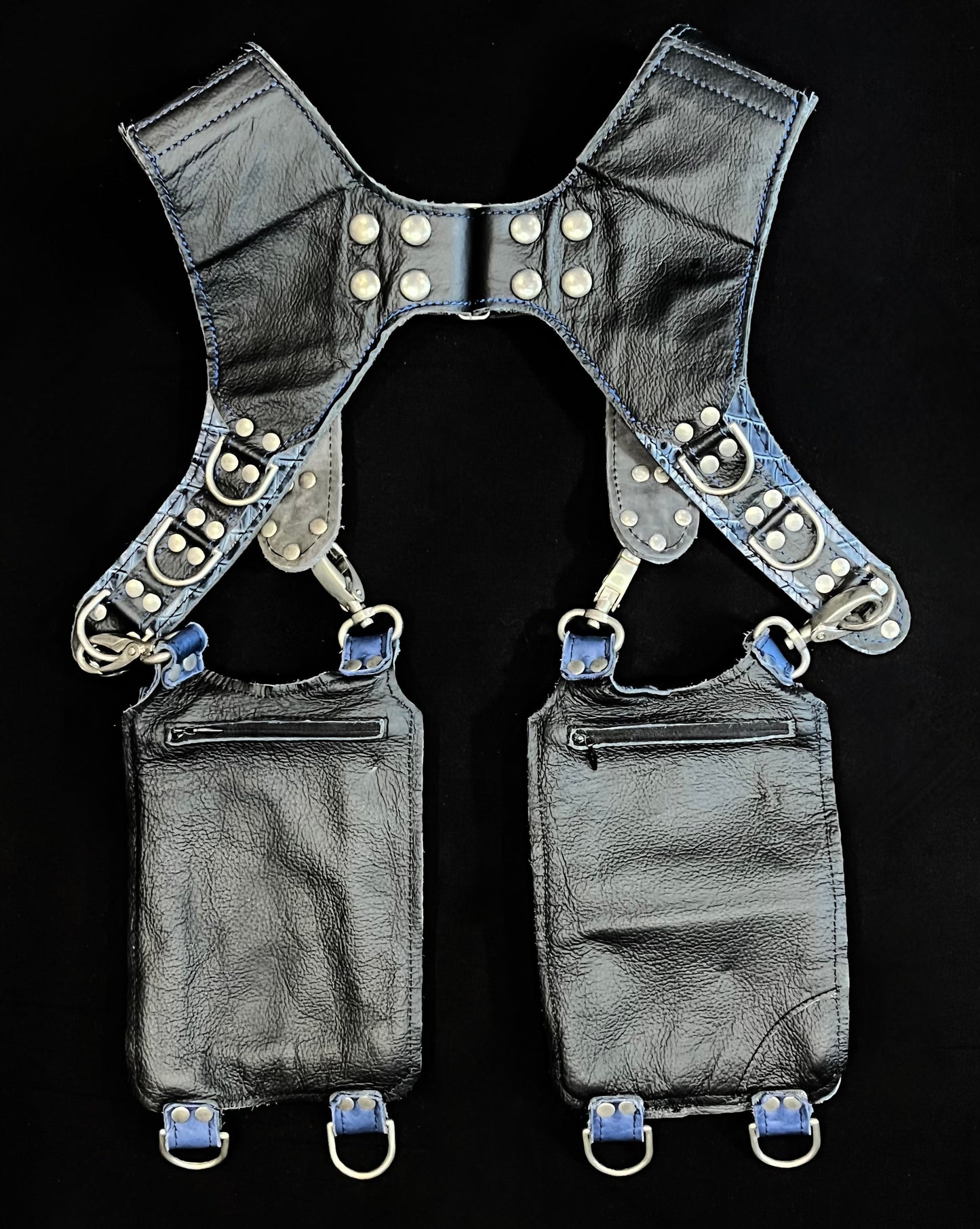 back view of blue croc and black leather holster showing hidden zipper pockets on hanging pockets