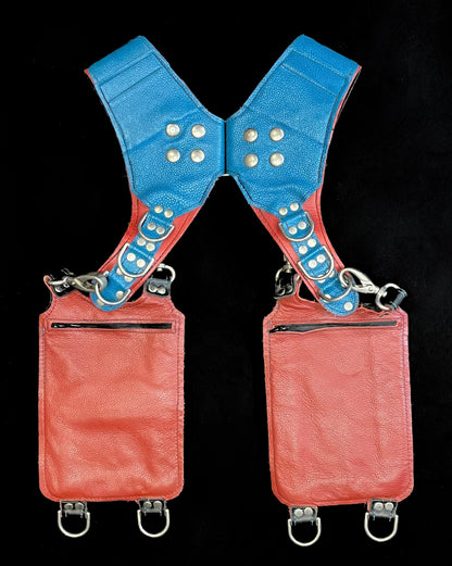 back view of terracotta, blue, and python leather holster showing hidden zipper pockets on hanging pockets