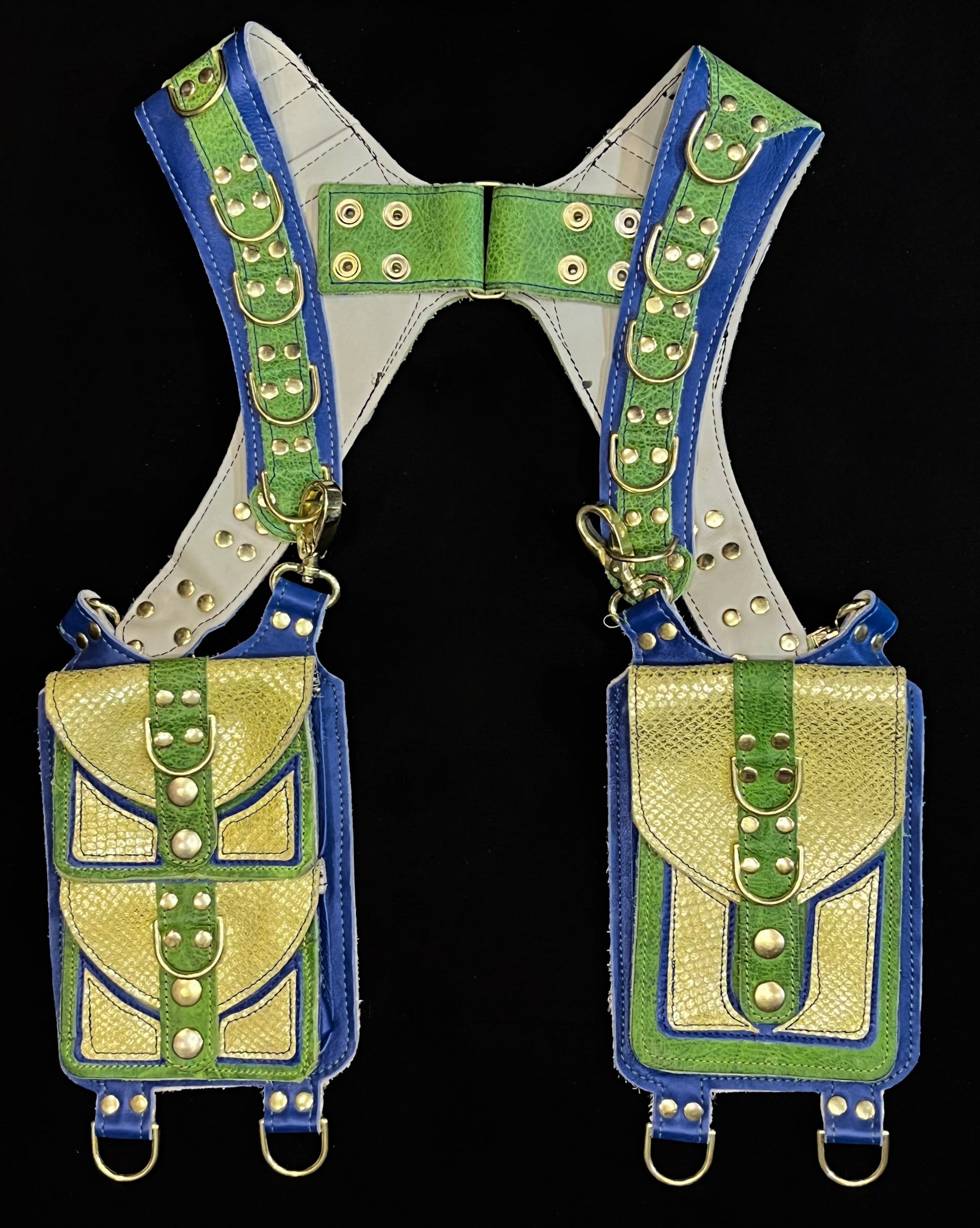 front view of green and blue holster with brass hardware