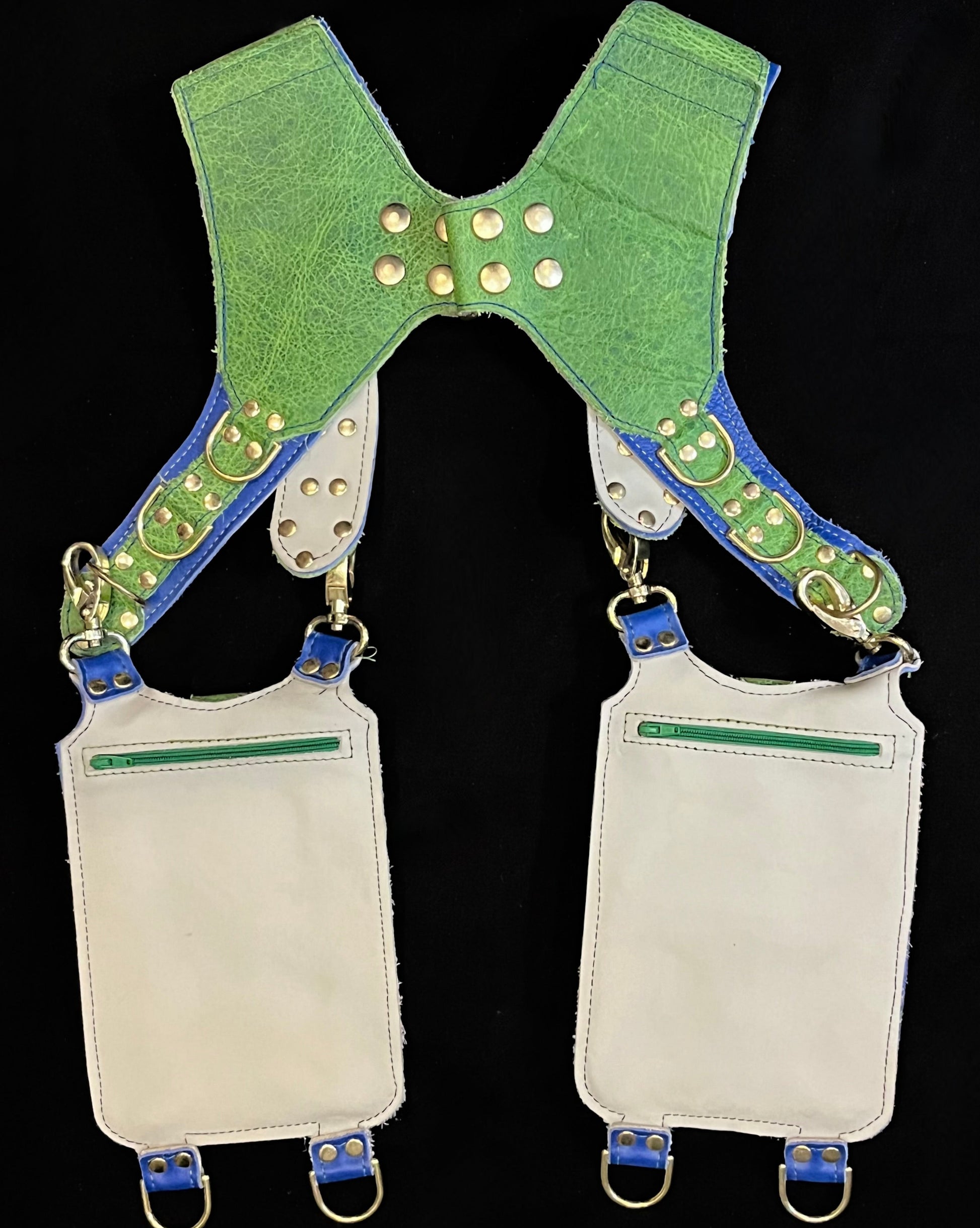 back view of green and blue holster showing hidden zipper pockets on hanging pockets