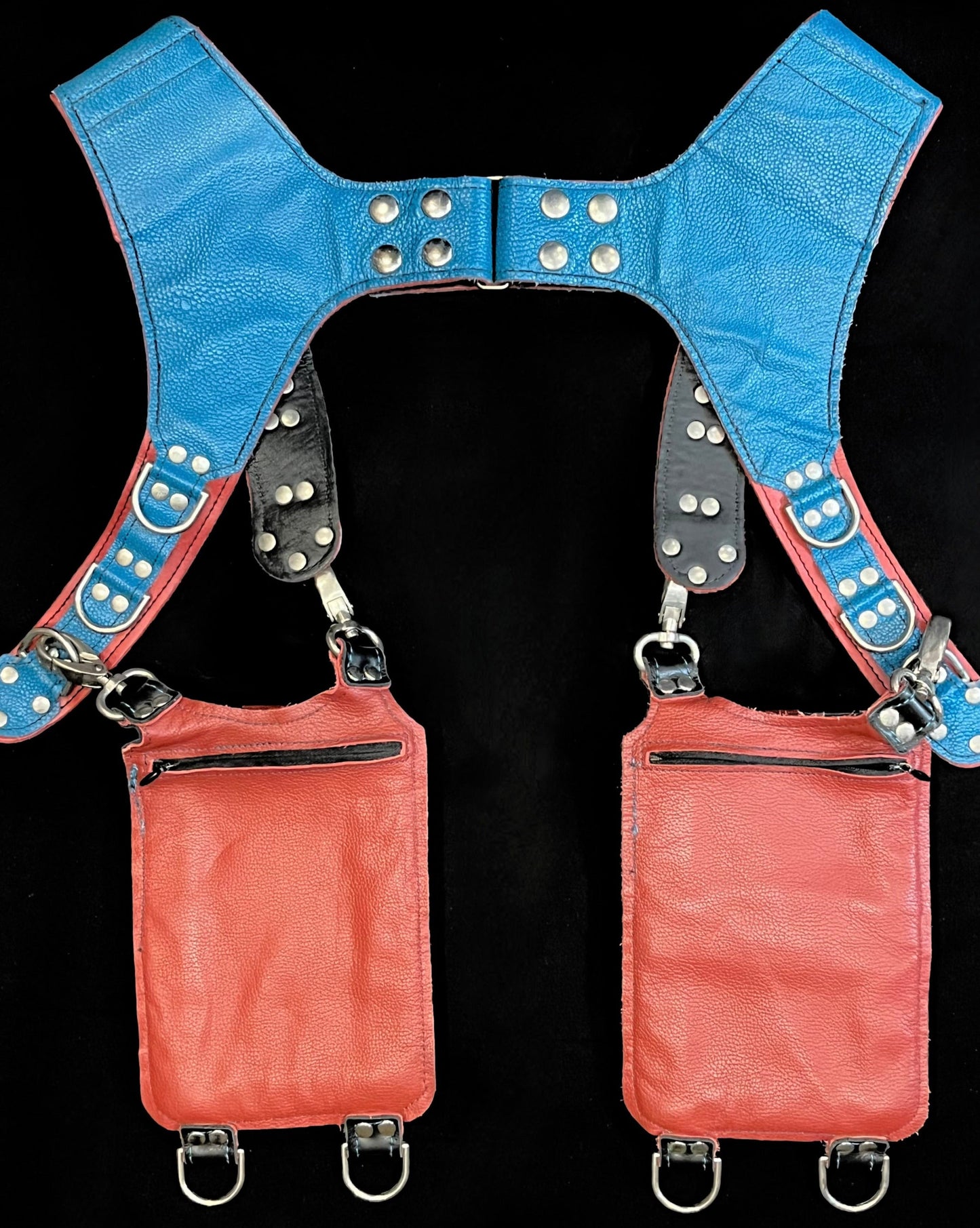 back view of terracotta, blue, python holster showing hidden zipper pockets