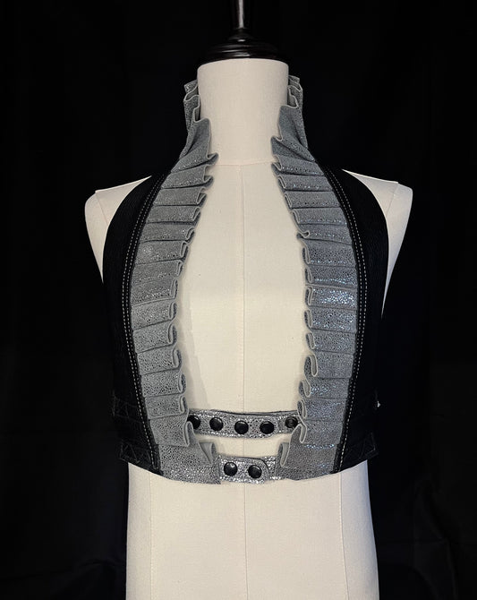 grey stingray and black leather ruff top with blcak hardware on an ivory gender neutral mannequin against a black background