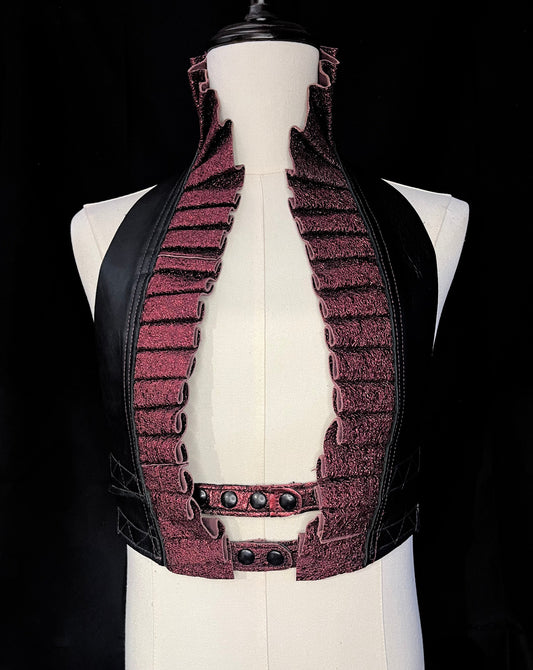 black and garnet crinkle leather ruff top with black hardware on an ivory gender neutral mannequin against a black background