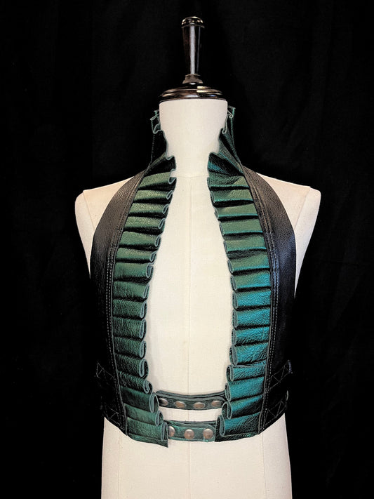 metallic emerald green leather ruff with a black leather neck and nickel hardware on an ivory non-gender mannequin against a black background