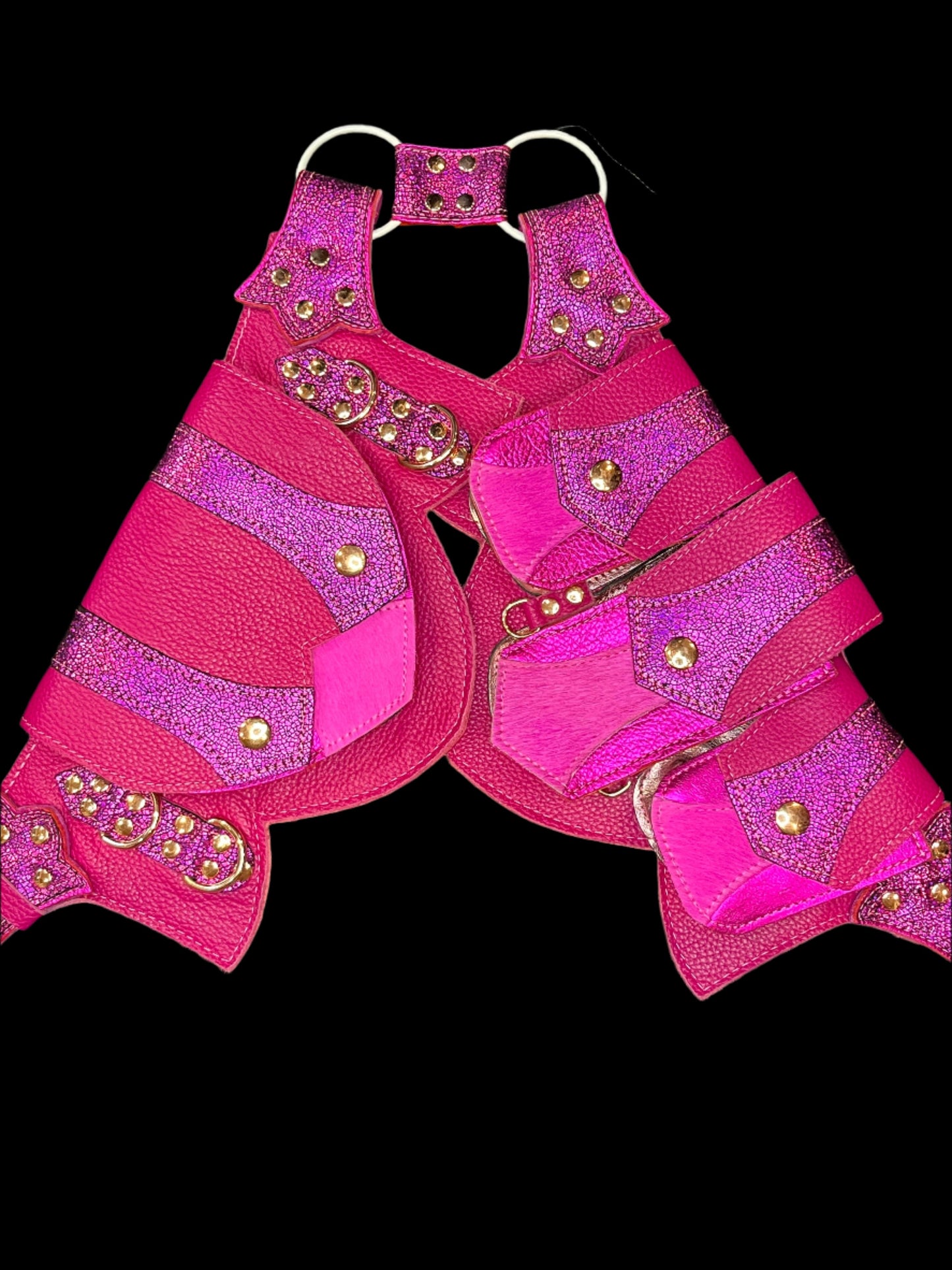 Combination of pink leathers regal belt laid flat on a black background