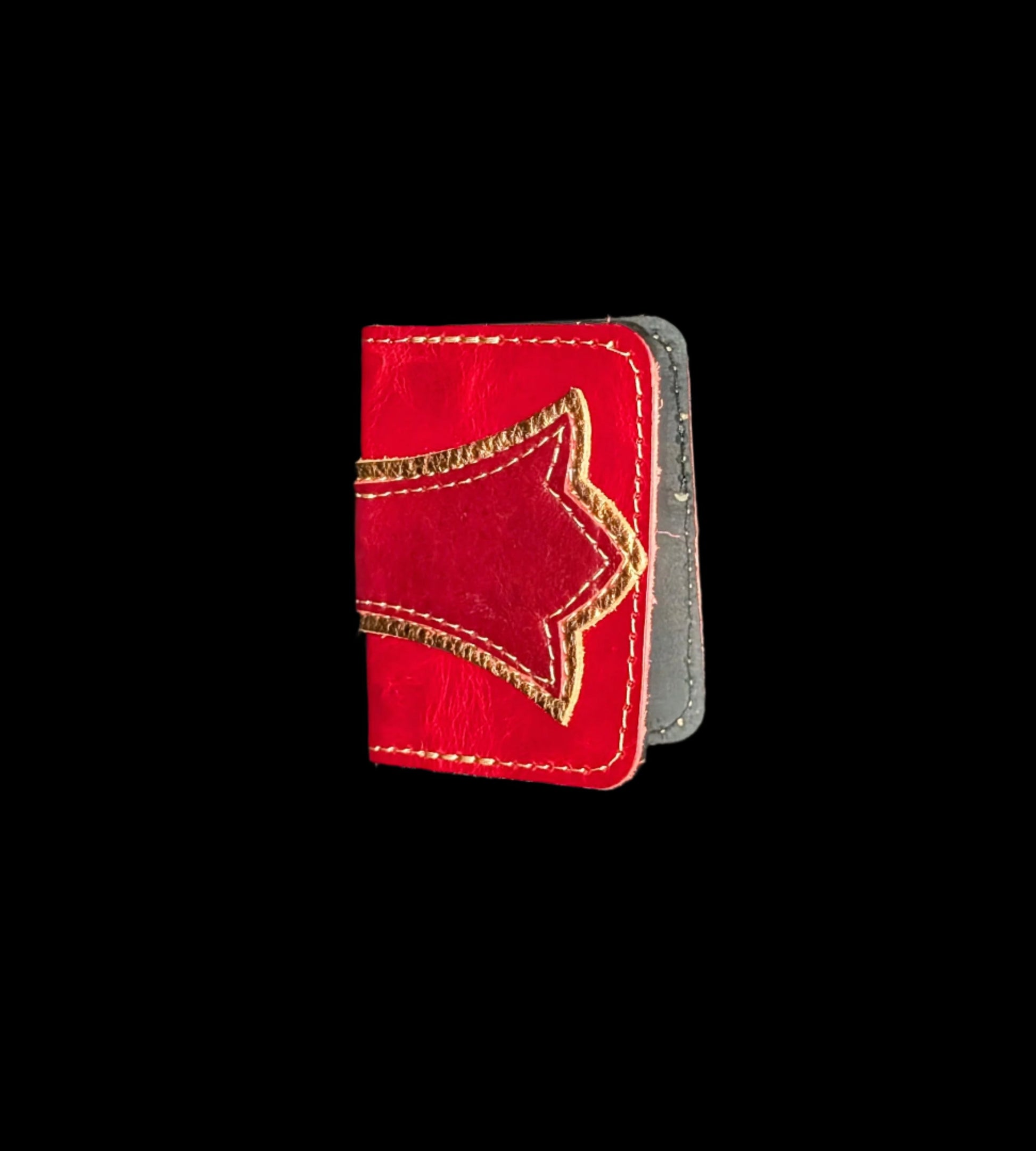 A wallet folded in half showing a base color of red leather with a layered trident accent in bronze and red leather with red and bronze stitching.