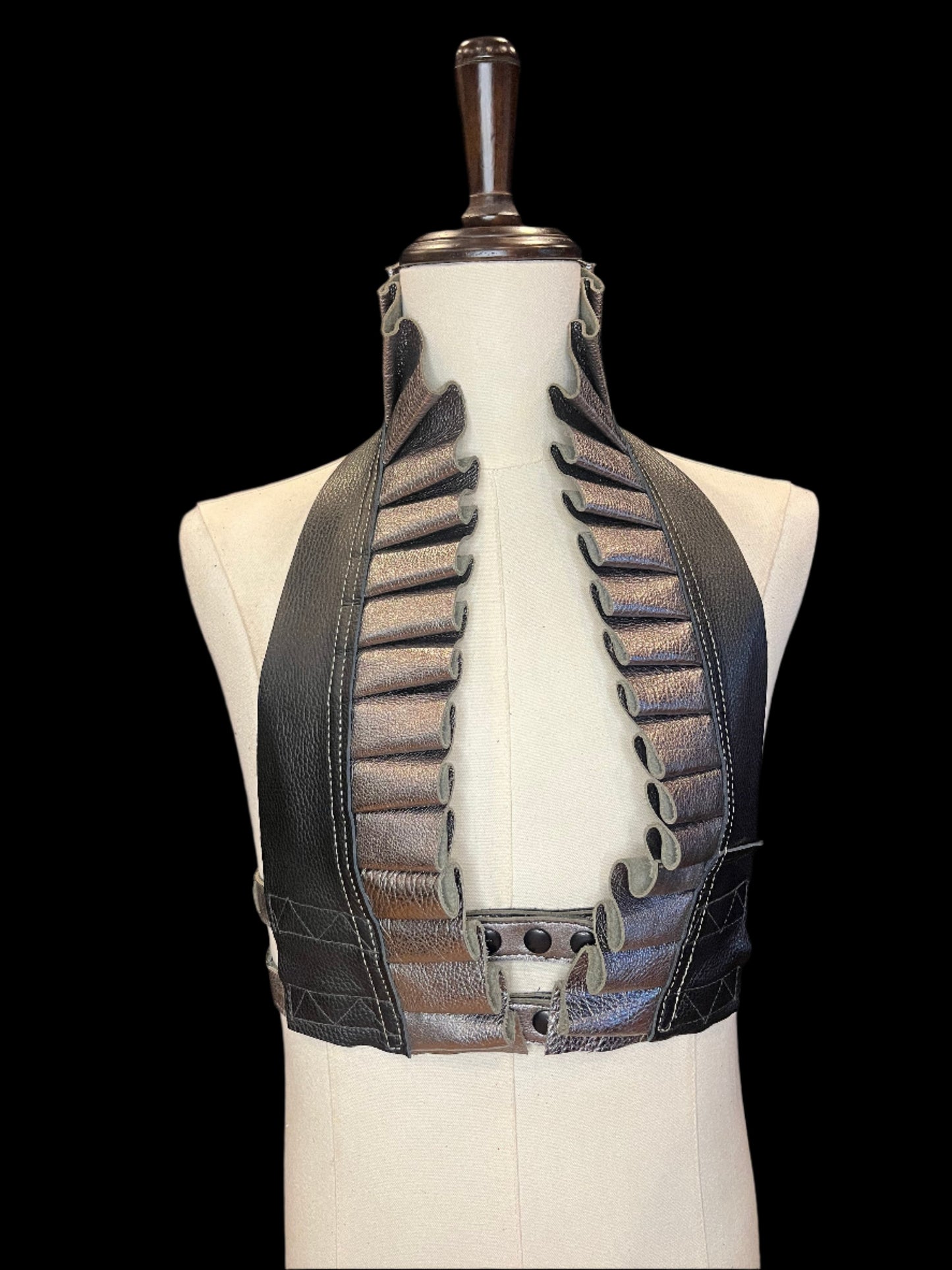 Pewter ruff top on an ivory gender neutral mannequin against a black background showing black hardware